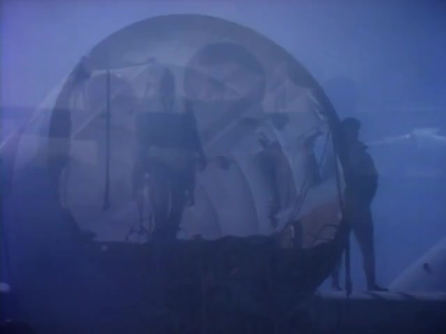 Still from "Take my breath away" music video